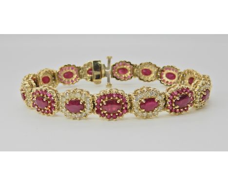 A 9CT GOLD RUBY AND DIAMOND BRACELET set with oval cut rubies of approx 5.7mm x 4.2mm, and brilliant cut diamonds to an estim