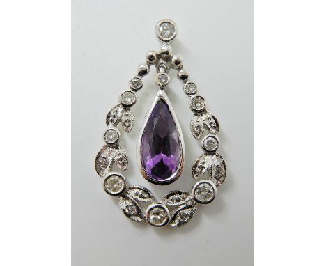 AN 18CT WHITE GOLD AMETHYST AND DIAMOND PENDANT diamonds estimated approximately 0.35cts, 2.8cm x 1.8cm, weight 3.6gm Conditi