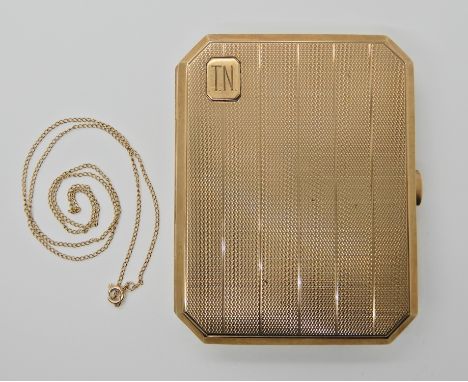A 9CT GOLD CIGARETTE BOX dimensions 8.5cm x 6.7cm x 1.5cm by Deakin &amp; Francis Ltd Birmingham 1953, with all over linear e
