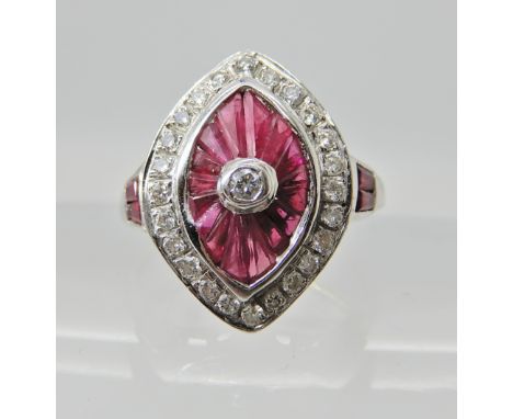 AN 18CT WHITE GOLD DIAMOND AND RUBY RING in the Art Deco style, with pierced galleried mount. Finger size N, weight 3.7gms Co