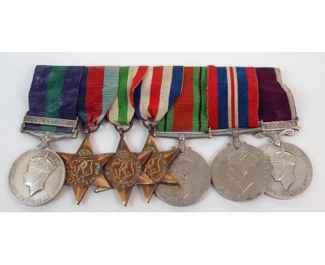 A GROUP OF FIVE WWII MEDALS with a Malaya General Service medal to 3240748 R.F.M.N. T. Gibson, Cameronians and a regular army