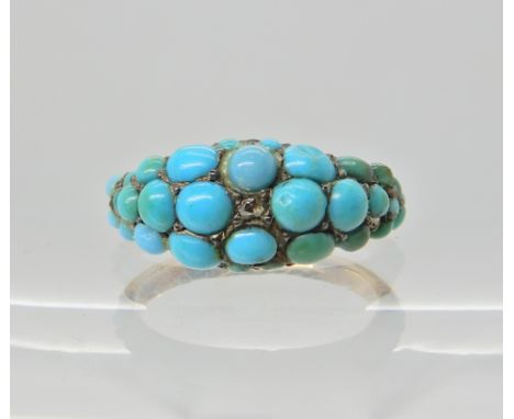 A YELLOW METAL TURQUOISE AND DIAMOND CLUSTER RING Finger size K, weight 3.6gms Condition Report: about three of the turquoise