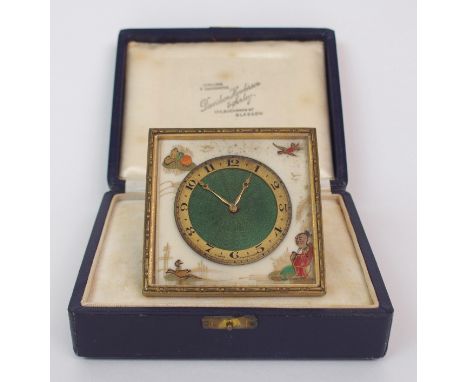 AN EARLY 20TH CENTURY 8 DAY STRUT CLOCK the green guilloche enamel dial with gilded chapter ring and Arabic numerals, the cor