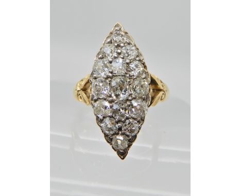 AN 18CT GOLD OLD CUT DIAMOND RING OF MARQUIS SHAPE set with estimated approximate 1.29cts of diamonds set to a galleried moun
