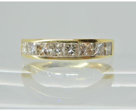 AN 18CT YELLOW GOLD EIGHT PRINCESS CUT DIAMOND ETERNITY RING of estimated approx 1.20cts in total. Span of diamond set area 1