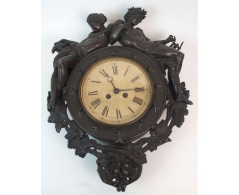 A SPELTER WALL CLOCK the central paper dial marked Ritchie &amp; Son, Edinburgh and surrounded by a ring of stars, mounted to
