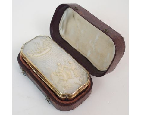 A 19TH CENTURY FRENCH SILVER GILT SNUFF BOX of rectangular form, the hinged mother of pearl set cover carved in relief with D