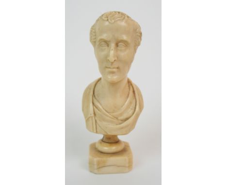 A MID 19TH CENTURY MINIATURE PORTRAIT BUST OF THE DUKE OF WELLINGTON on socle base, 12cm high overall Condition Report: Avail