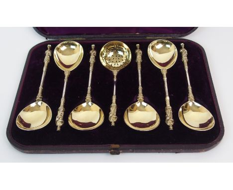 A CASED SET OF SIX VICTORIAN SILVER GILT APOSTLE SERVING SPOONS WITH A STRAINING SPOON by Harrison Brothers &amp; Howson (Hen