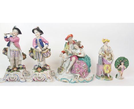 A PAIR OF SAMSON STYLE FIGURES OF BOYS one modelled drumming the other playing a pipe, 28cm high, together with three other f