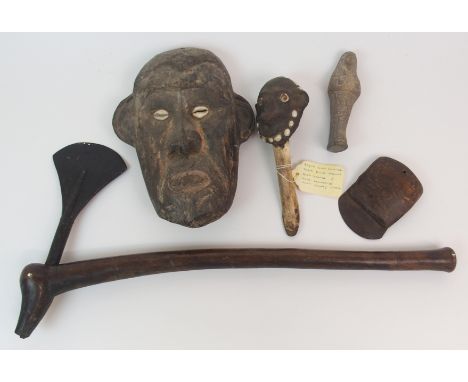 A SEPIK TOREMBI TRIBE WOOD MASK with insect cowrie shell eyes, 26cm high, Sepik bone dagger with head handle set with shells,