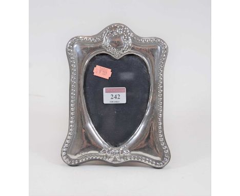 A modern silver easel photograph frame, 20cmCondition report: Hallmarked, maker SF Ltd.Glass good.Velvet back very worn and p