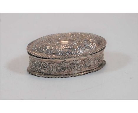 A circa 1900 silver and embossed trinket box of oval form, 2.1oz, 10cm