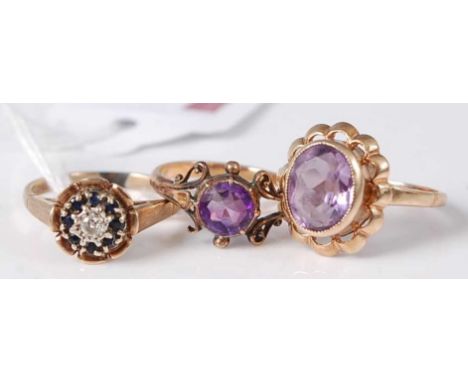 A 9ct  gold sapphire and diamond flower head cluster ring, size N, together with two 9ct gold amethyst set dress rings, gross