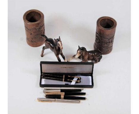 A small collection of miscellaneous items, to include a Beswick model of a foal, a pair of carved brush pots, various pens et