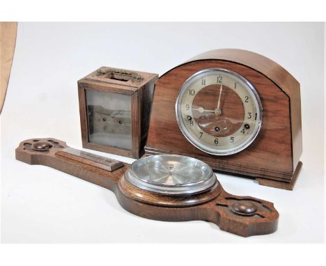 A late 19th century rosewood and marquetry inlaid mantel clock, having engine turned silvered dial with Roman numerals and ei
