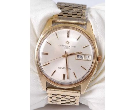 A gents Eterna-Matic 3000 gilt metal and steel cased wristwatch having a signed silver dial with day date aperture, baton mar