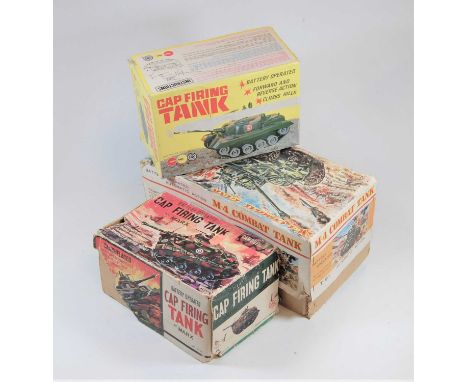 Two boxed Marx Toys battery operated cap-firing tanks; together with a boxed battery operated automatic action T-91 M-4 comba