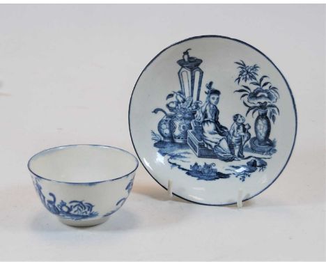 An 18th century Worcester porcelain tea bowl on stand, blue and white decorated in the Mother &amp; Child patternCondition re