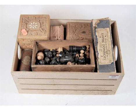 A turned boxwood and ebony chess set; together with a boxed set of Empire dominoes, playing card boxes etc 
