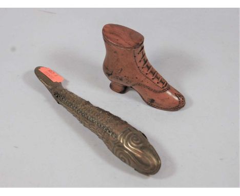 A 19th century carved boxwood snuff box in the form of a lady's boot, h.6.5cm; together with a brass reticulated model of a f
