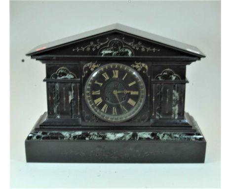 A large late 19th century black slate and veined marble cased mantel clock of architectural form, the black chapter ring with