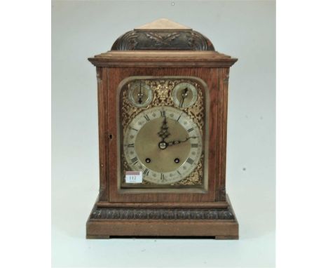 A late 19th century Winterhalder &amp; Hofmeier oak cased bracket clock, having an arched brass dial with gilt spandrels, sil