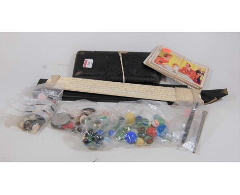 A small collection of miscellaneous items, to include Victorian Jubilee medal, various glass marbles, Thornton's sliding rule