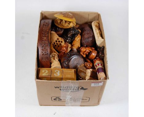 A box of miscellaneous items, to include reproduction carved  boxwood and resin netsuke, perpetual desk calendar, modern carv