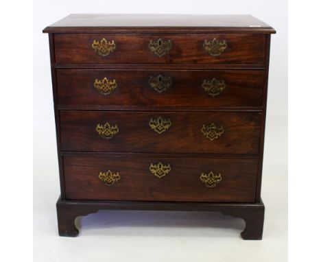A 19TH CENTURY MAHOGANY CHEST OF FOUR LONG DRAWERS with cross banded top and standing on bracket feet, 80cm wide x 46.5cm dee