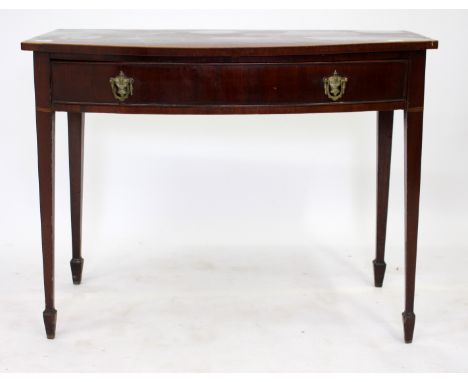 A 19TH CENTURY MAHOGANY BOW FRONTED SIDE TABLE with rosewood cross banded decoration, frieze drawer and square tapering legs,