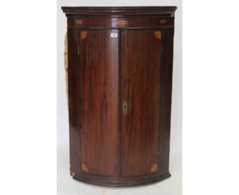 A 19TH CENTURY MAHOGANY BOW FRONTED CORNER CABINET  with box line inlay, 114cm x 71cm 