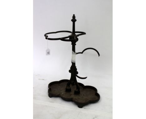 A 19TH CENTURY CAST IRON STICK STAND with scalloped base, possibly Coalbrookdale, 46cm diameter (damaged)