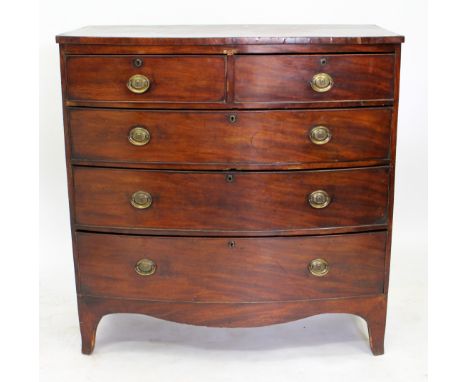 AN EARLY 19TH CENTURY BOW FRONTED MAHOGANY CHEST OF TWO SHORT AND THREE LONG DRAWERS standing on bracket feet, 102cm wide 