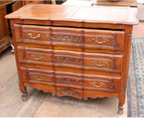 A CONTINENTAL COMMODE with three long drawers and brass handles, 120cm wide x 60cm deep x 96cm high