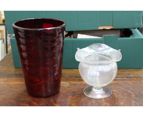 A MARRIOTT POWELL 1950'S RUBY GLASS VASE 25cm high together with an iridescent glass footed vase with wavy rim by John Walsh,