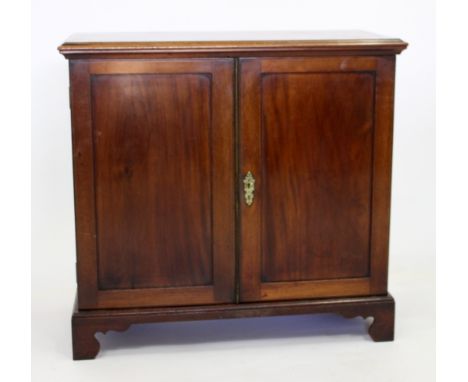 A VICTORIAN MAHOGANY DWARF CABINET with chevron inlay fitted with two fielded panel doors and standing on bracket feet, 81cm 