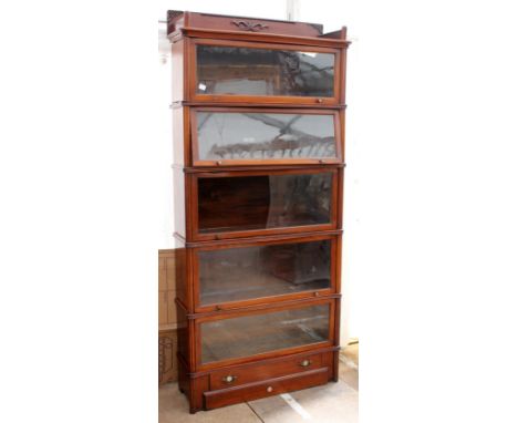 A FIVE SECTION MAHOGANY GLOBE WERNICKE BOOKCASE with galleried top, five glazed doors and a single drawer to the base, 92cm w