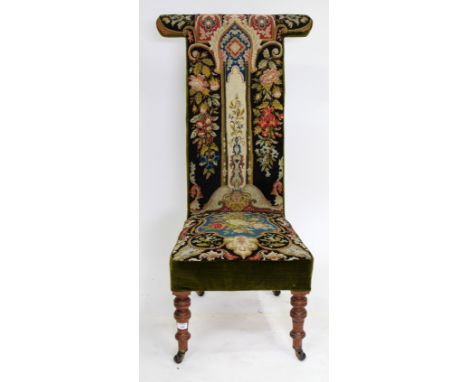 AN EARLY 20TH CENTURY TAPESTRY UPHOLSTERED HIGH BACK CHAIR standing on turned tapering legs terminating in porcelain castors 