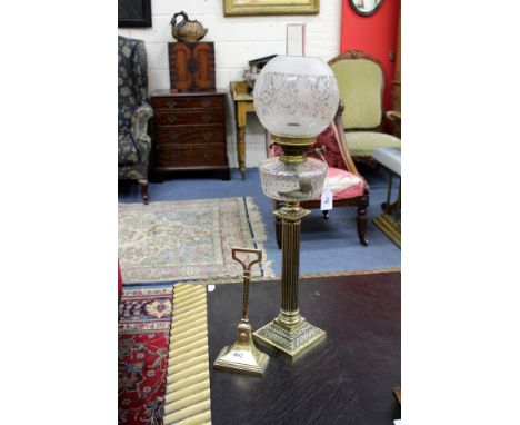 A VICTORIAN OIL LAMP  on brass Corinthian column base and with engraved glass shade, and a 19th century hall porter (2)