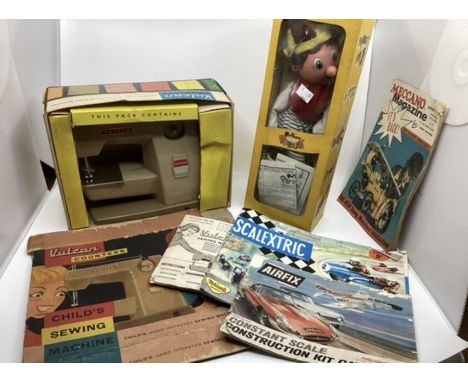 Vintage childrens toys to include a Pelham Disney Puppet a Vulcan boxed 1960s Sewing Machine ,scalextric &nbsp;brochure etc i