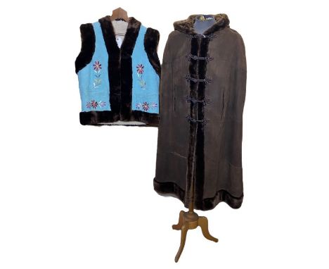 a 1960s/70s Afghan waistcoat / sheepskin gilet in turquoise with embroidered flowers, unisex, 46 inch chest to fit a man's s-