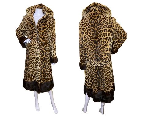 A 1960s leopard skin coat, full length with side vents, chocolate mink trim, two fur covered buttons, inner swing ties and a 