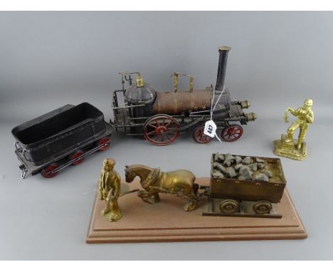 Vintage style tinplate steam engine and trolley car, a brass model of a miner with horse and cart on a plinth and a brass mod