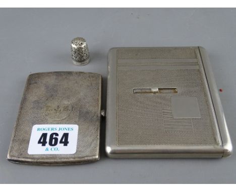 Silver cigarette case with engine turned decoration, an unmarked white metal example with sliding opening action and a thimbl