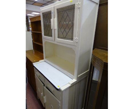 White painted kitchen dresser with enamel centre drawer shelf and two drawers and two cupboards