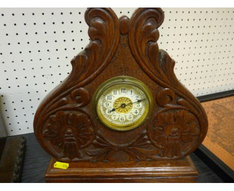 Carved and polished decorative mantel clock