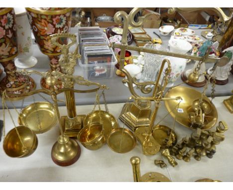 Five brass balance scales and a quantity of brass weights