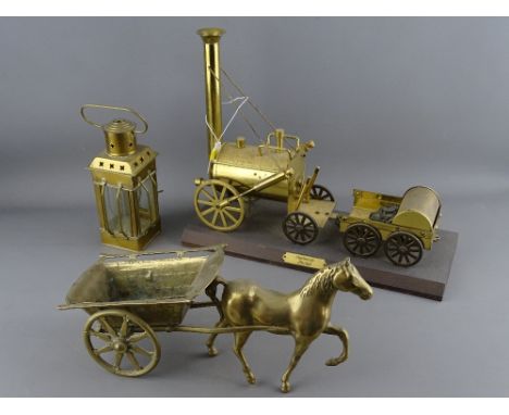 Brass model of Stephenson's Rocket on plinth, a horse and carriage and a small hanging lantern