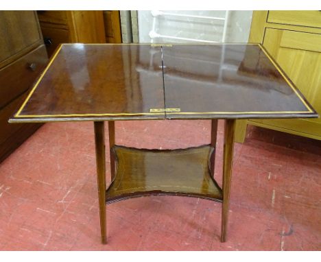 Mahogany and crossbanded Edwardian coffee table with shaped base shelf